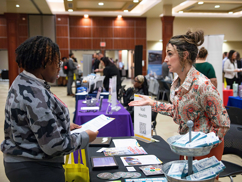 Image of student and employer at career fair