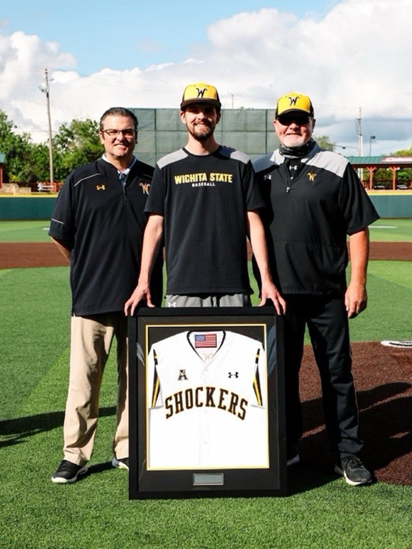 Brendan Kohler stands with former Athletic Director Darron Boatright and former baseball Head Coach Eric Wedge. 