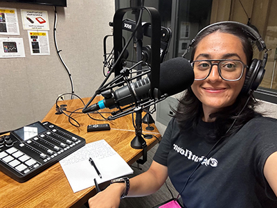 Nidhi Shenoy works on a podcast for The Sunflower.
