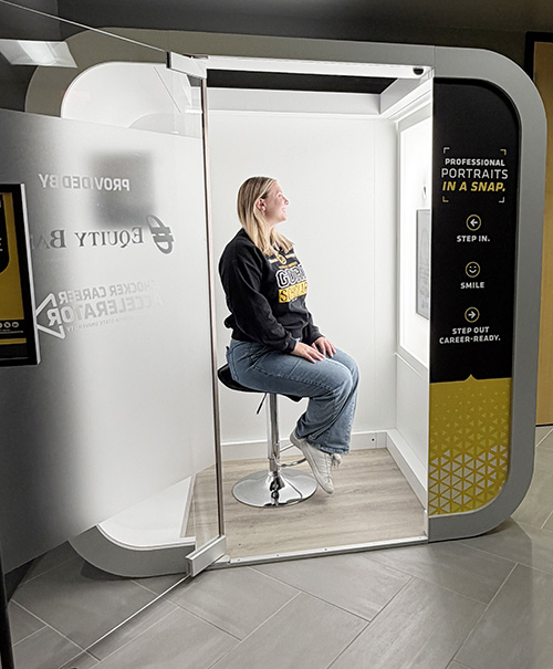A student using the Shocker Career Accelerator photo booth.