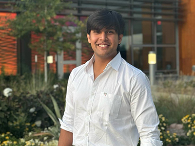 Pandey Akash smile at the camera outside of Woolsey Hall.