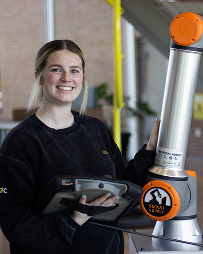 Haylee Thurman works with the robots in the NIAR Automation Research Center.