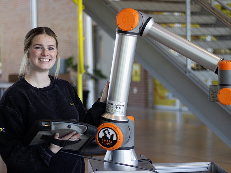 Haylee Thurman works with the robots in the NIAR Automation Research Center.