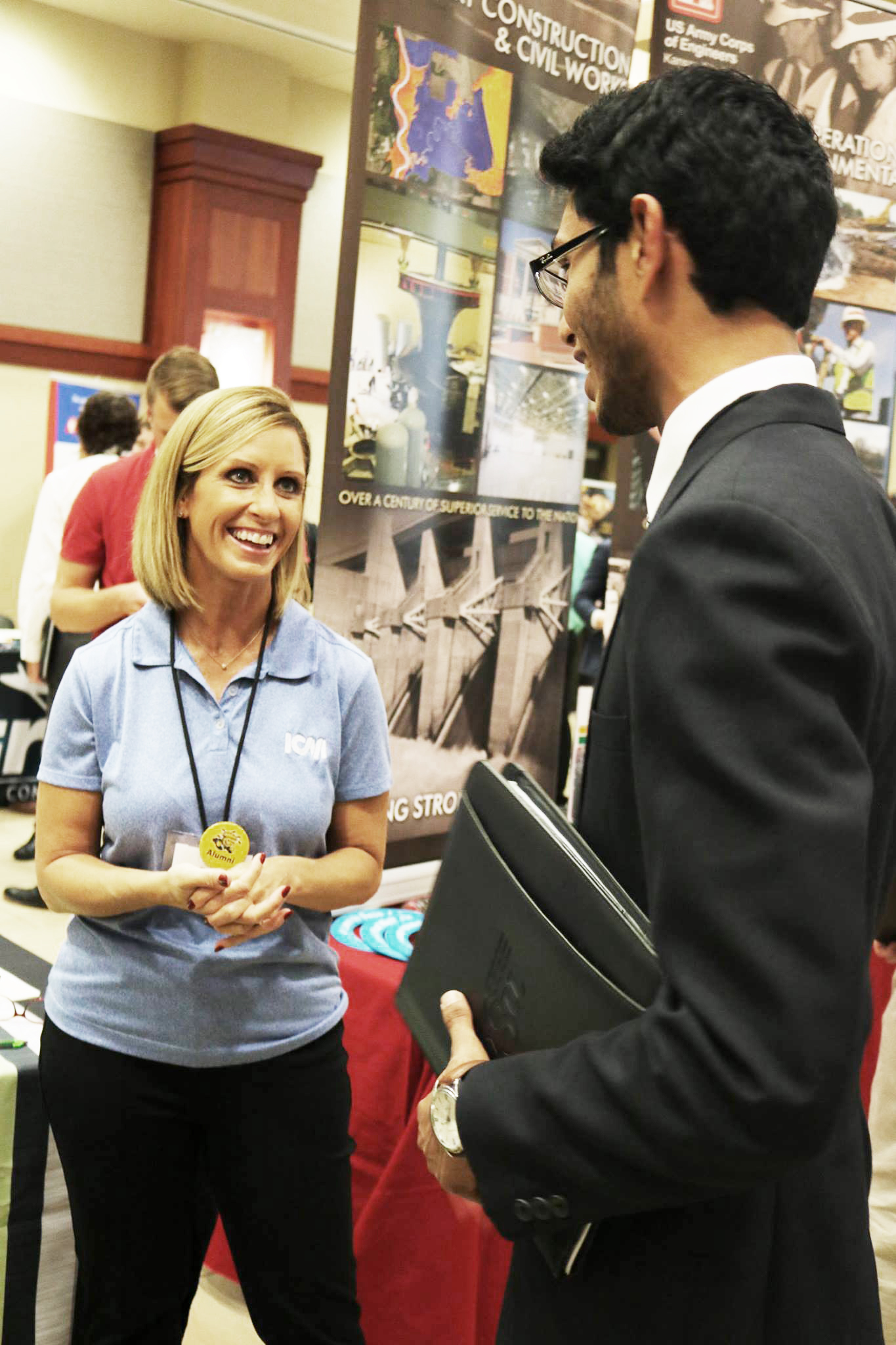 Employer speaking with a student at a career fair