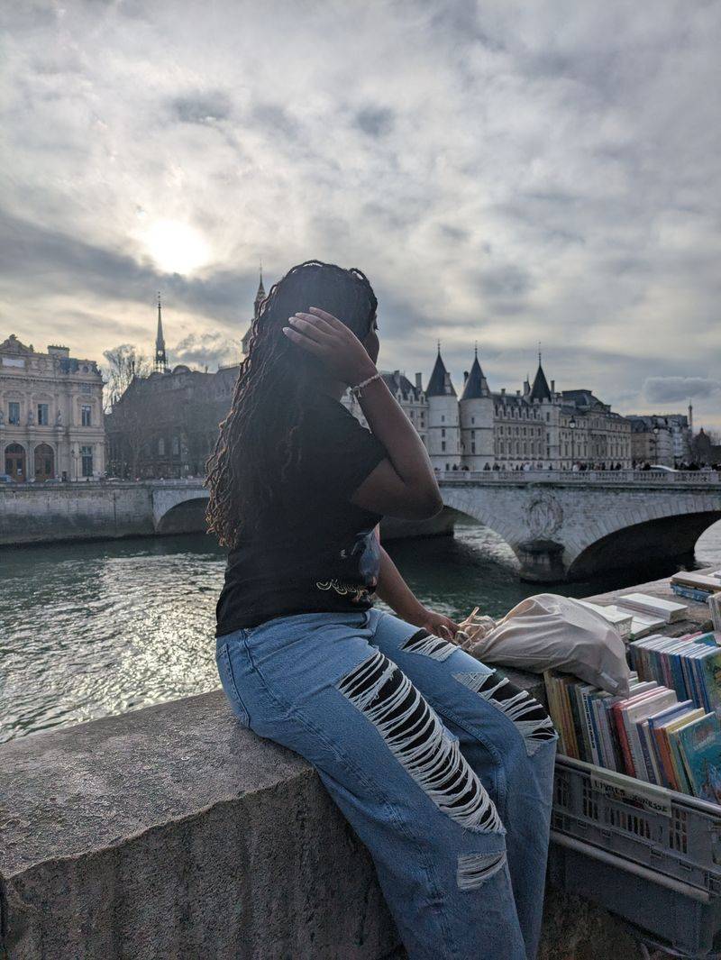 Girl Sitting byThe River Seine