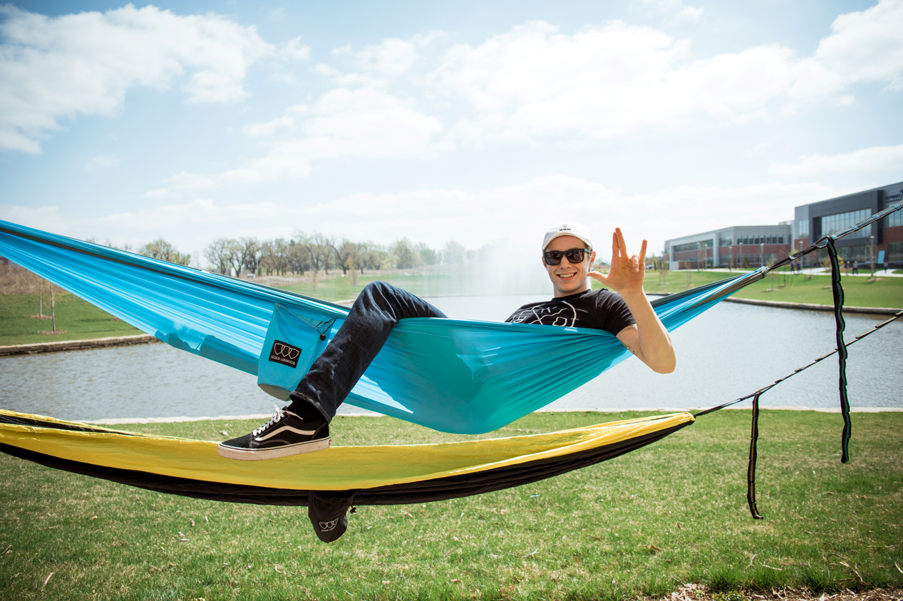 Guy in Hammock at Food Truck Plaza on WSU campus