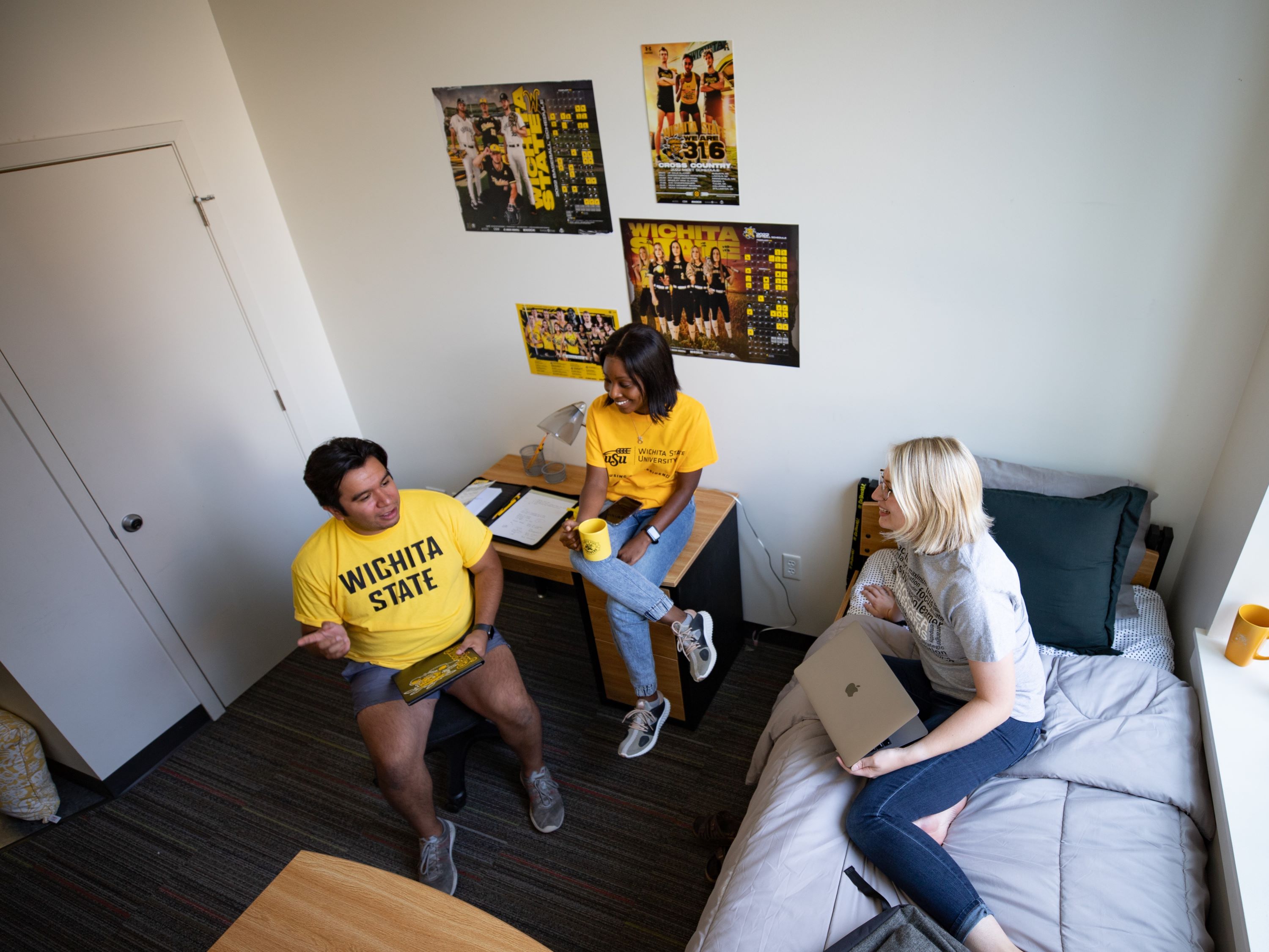 students chatting in dorm room