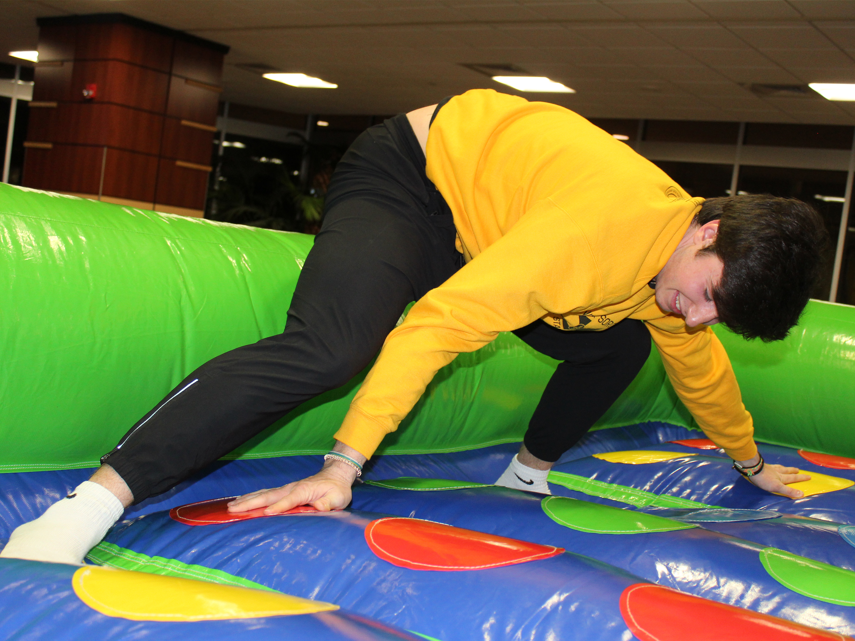 Shockers After Dark student playing twister
