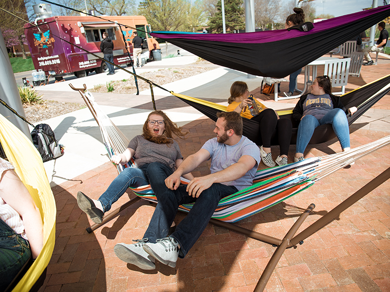 Students enjoying the hammocks on campus