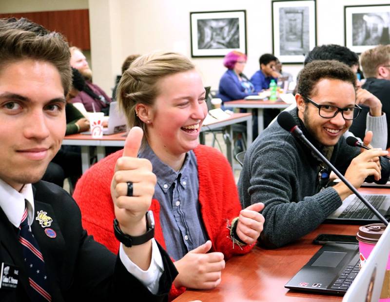 Student Government Association senators Ciaban Peterson, Kathlynn Short and Lucas Webb sit in the Senate chamber in RSC 233.