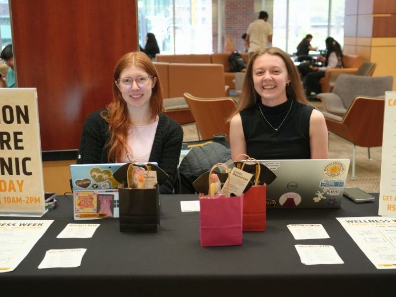 Director Arens & Senator Otten at a table for the Visions Care Clinic