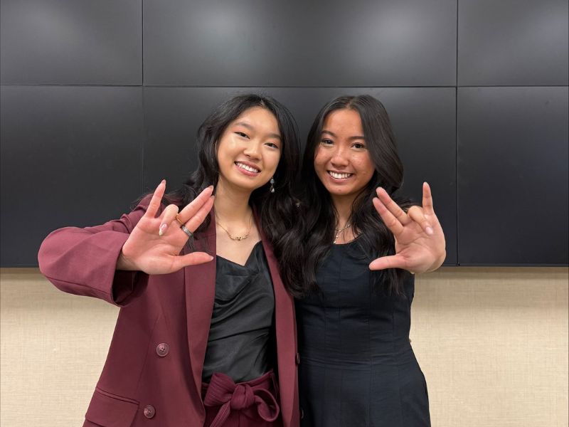 President Wang and Vice President Nguyen holding Shocker Sign