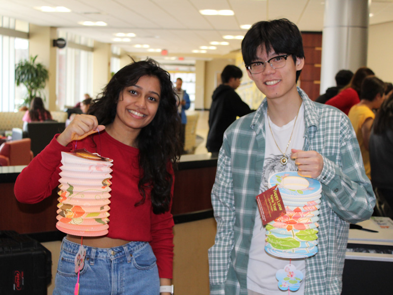 Students holding paper lanterns at lunar new year festival
