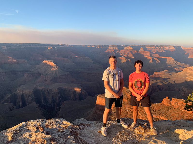 Two students in front of Grand Canyon