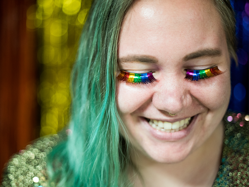 Student showing off their rainbow eyelashes during Pride Prom. 