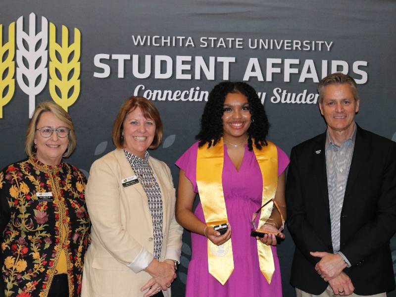 Student and dignitaries at University Awards ceremony