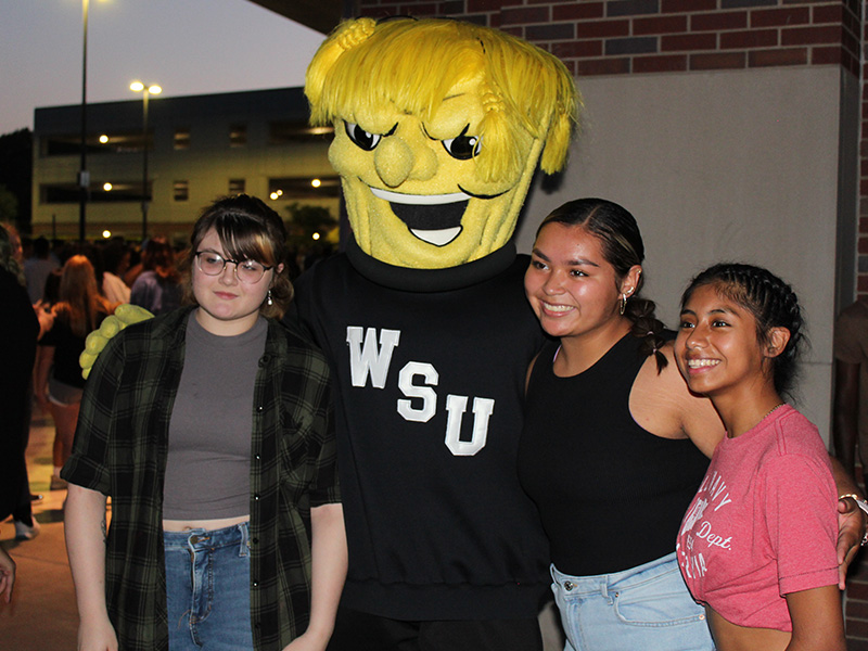 Three students standing with WuShock