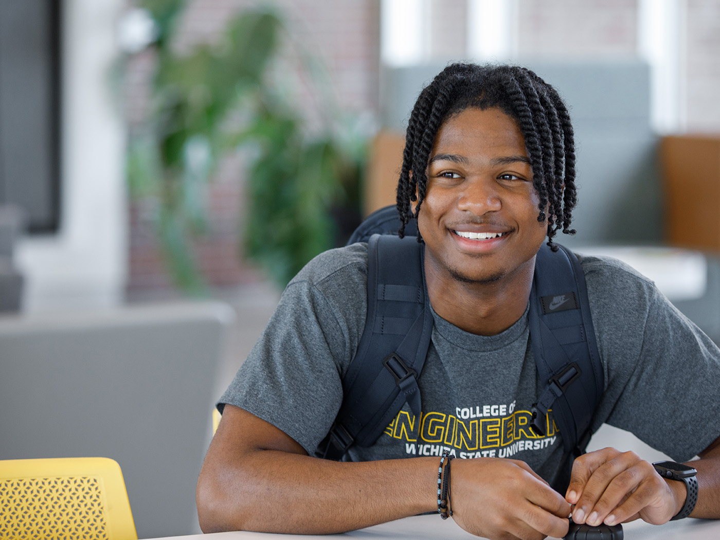 Student smiling with his backpack