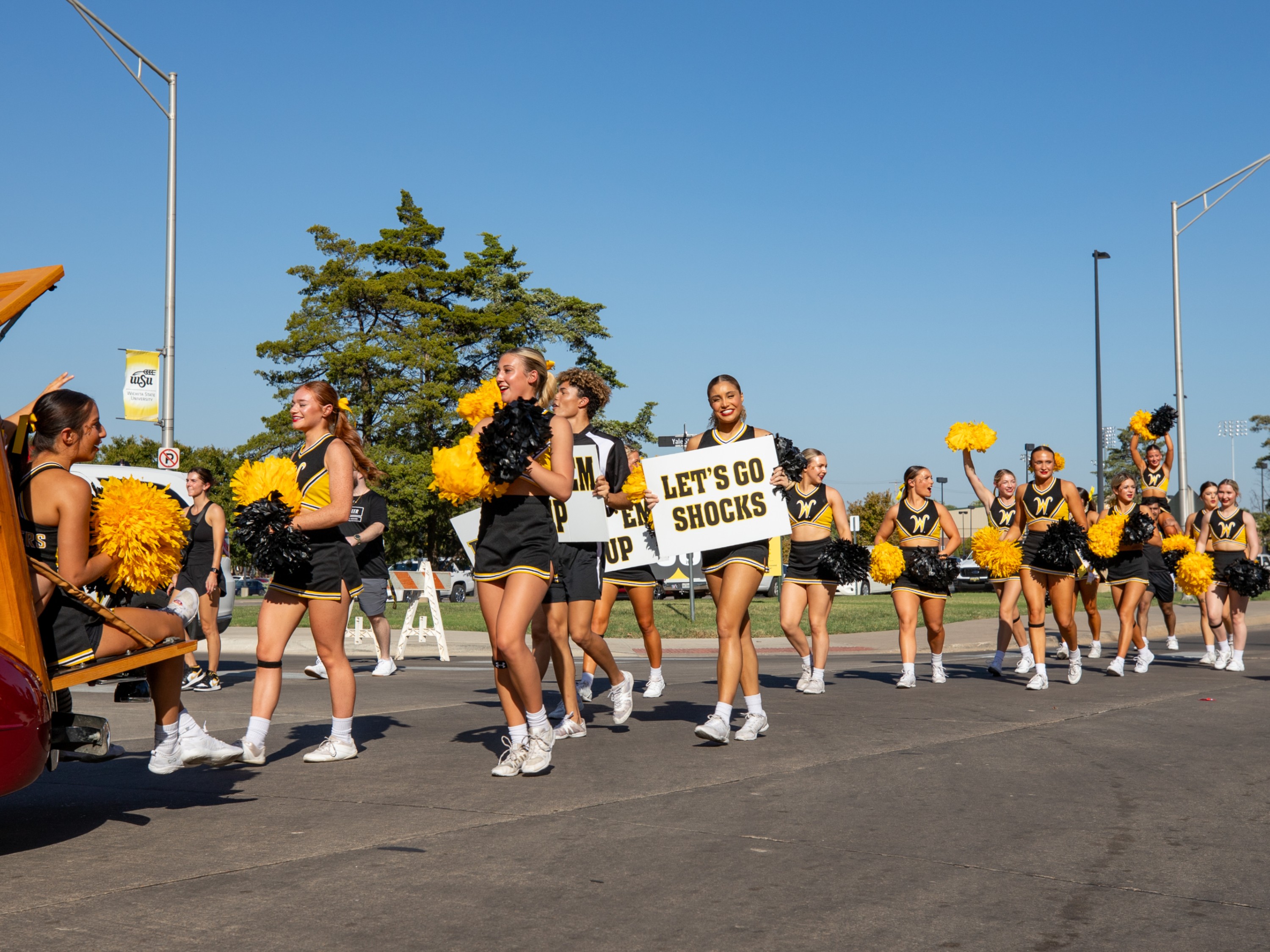 Students standing in a photo boot with Wu Shock