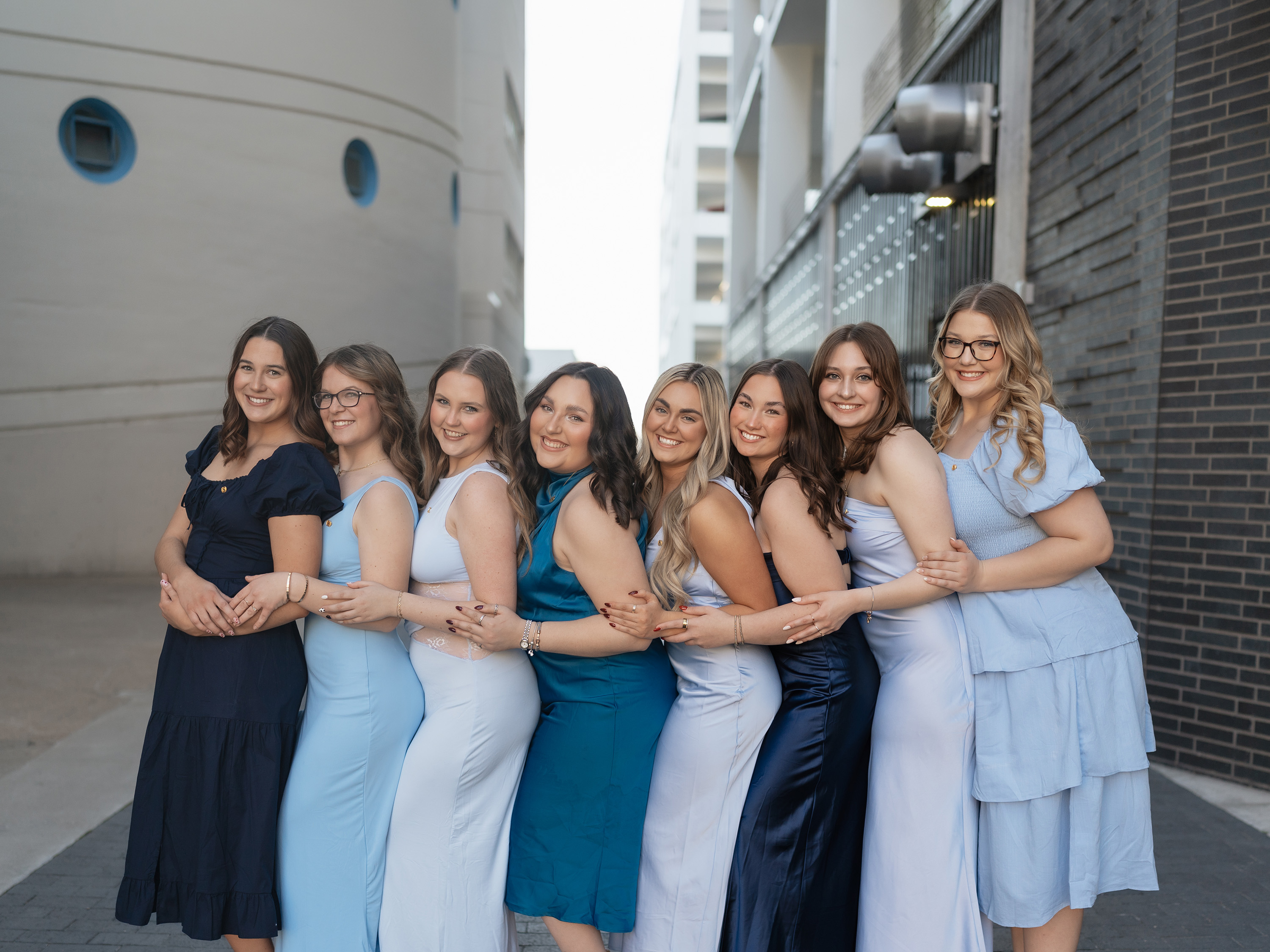 Panhellenic Council group photo in blue dresses.