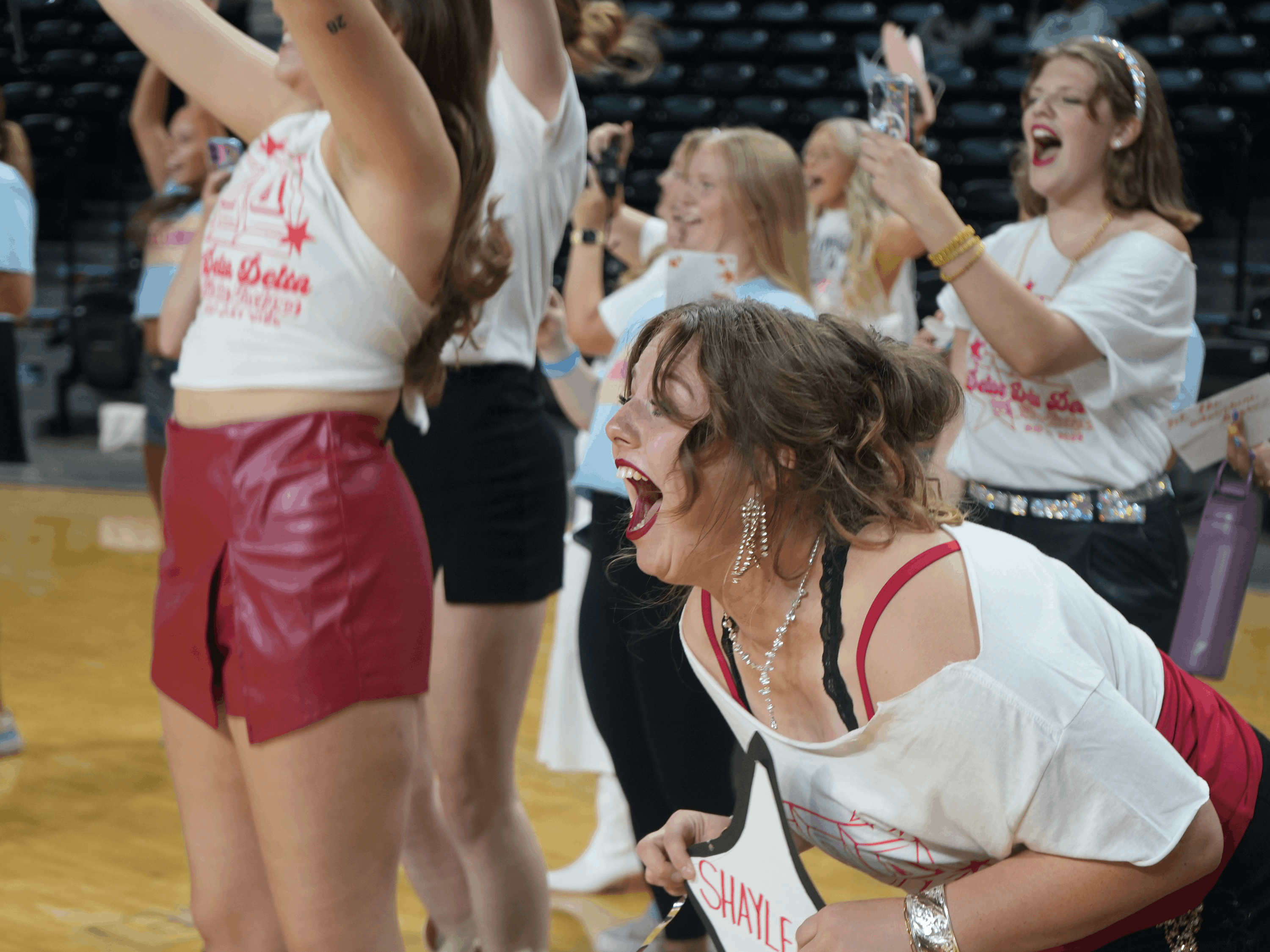 PC student yells with excitement about new sisters.